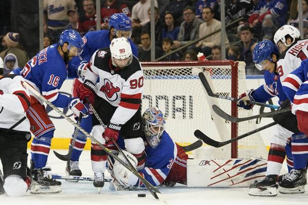 Rangers win 4 3 in OT to end Devils 11 game road win streak AP News